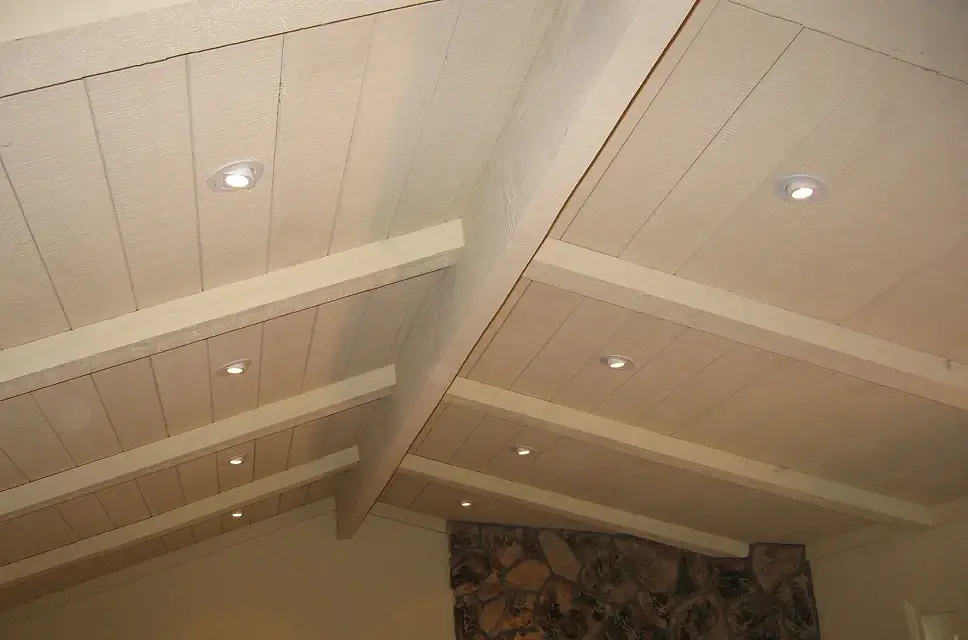 Recessed lighting between ceiling beams