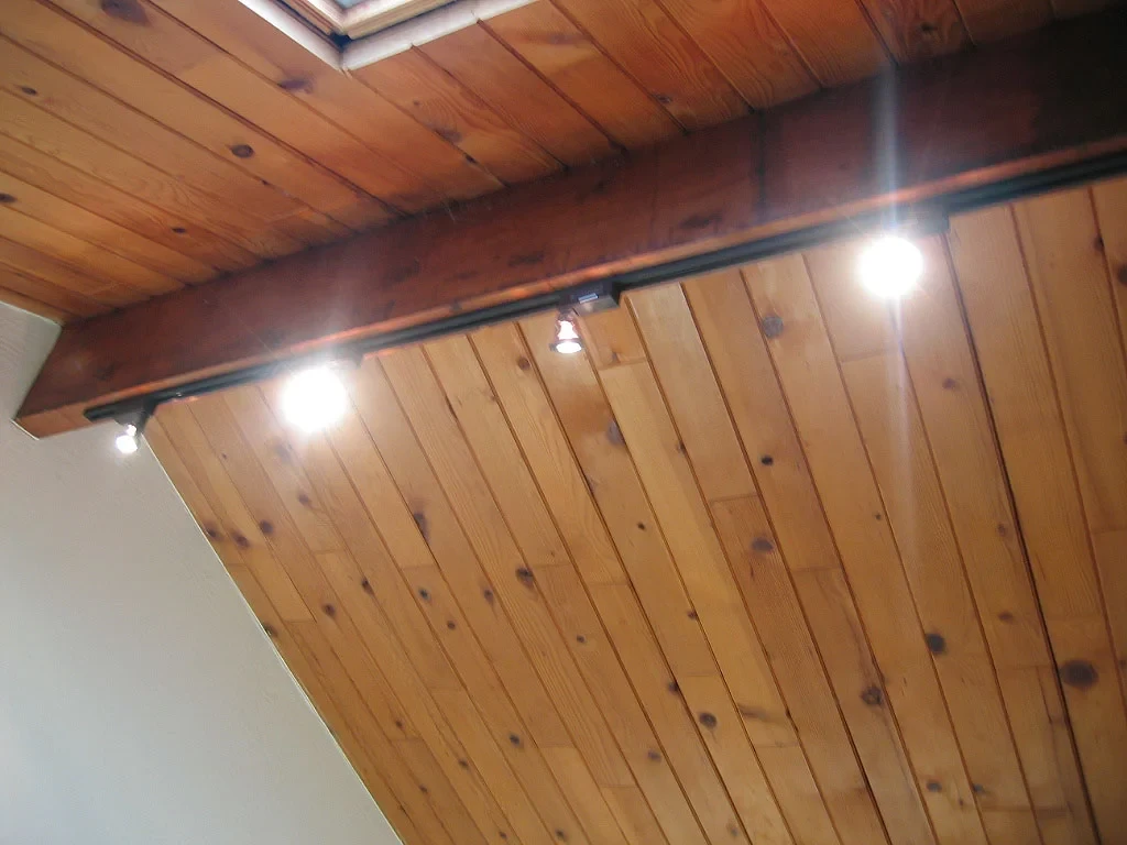 Track lighting on a timber ceiling